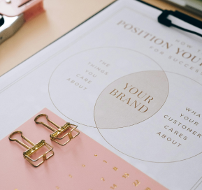 Personalised gifts displayed alongside a custom sheet featuring your brand, highlighting options for bespoke branding and customisation.
