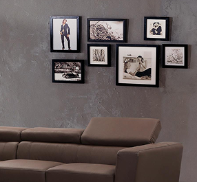 Black custom frames displayed on a wall, showcasing a sleek and modern arrangement.