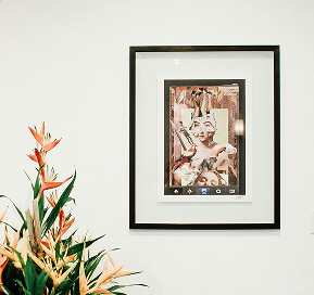 Custom-framed artwork hanging on a wall, showcasing a carefully chosen frame and matting that enhances the piece’s design, ready for display in a home or office.