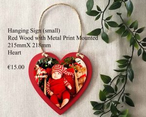 Small hanging sign made of red wood with a mounted metal print, measuring 215mm x 218mm.