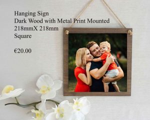 Square hanging sign made of dark wood with a mounted metal print, measuring 218mm x 218mm.