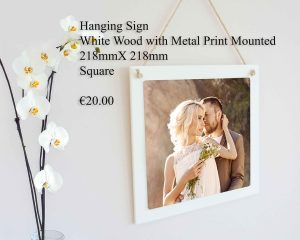Square hanging sign made of white wood with a mounted metal print, measuring 218mm x 218mm.