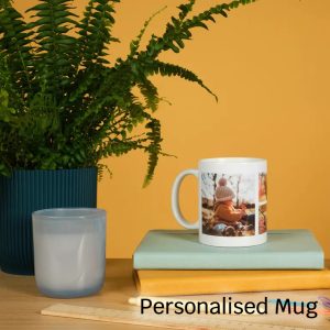 Personalised mug placed on top of a book, showcasing custom design options.