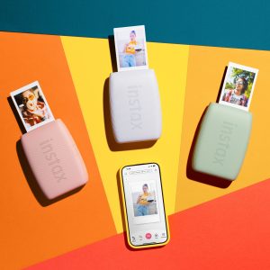 Instax Mini Link 3™ instant photo printer in Sage Green, Clay White, or Rose Pink, compact and wireless, printing instax™ mini photos with creative app features, motion control, and USB-C charging.